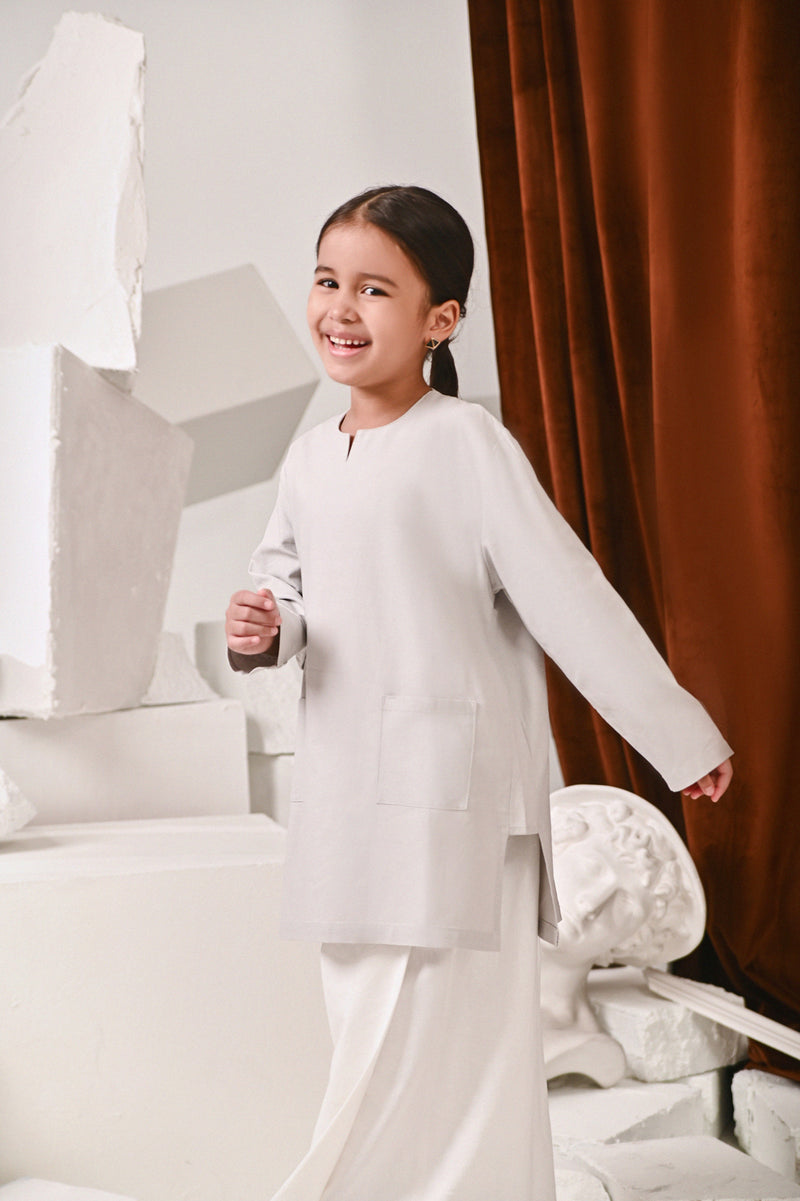 kurung pesak kelabu cair budak